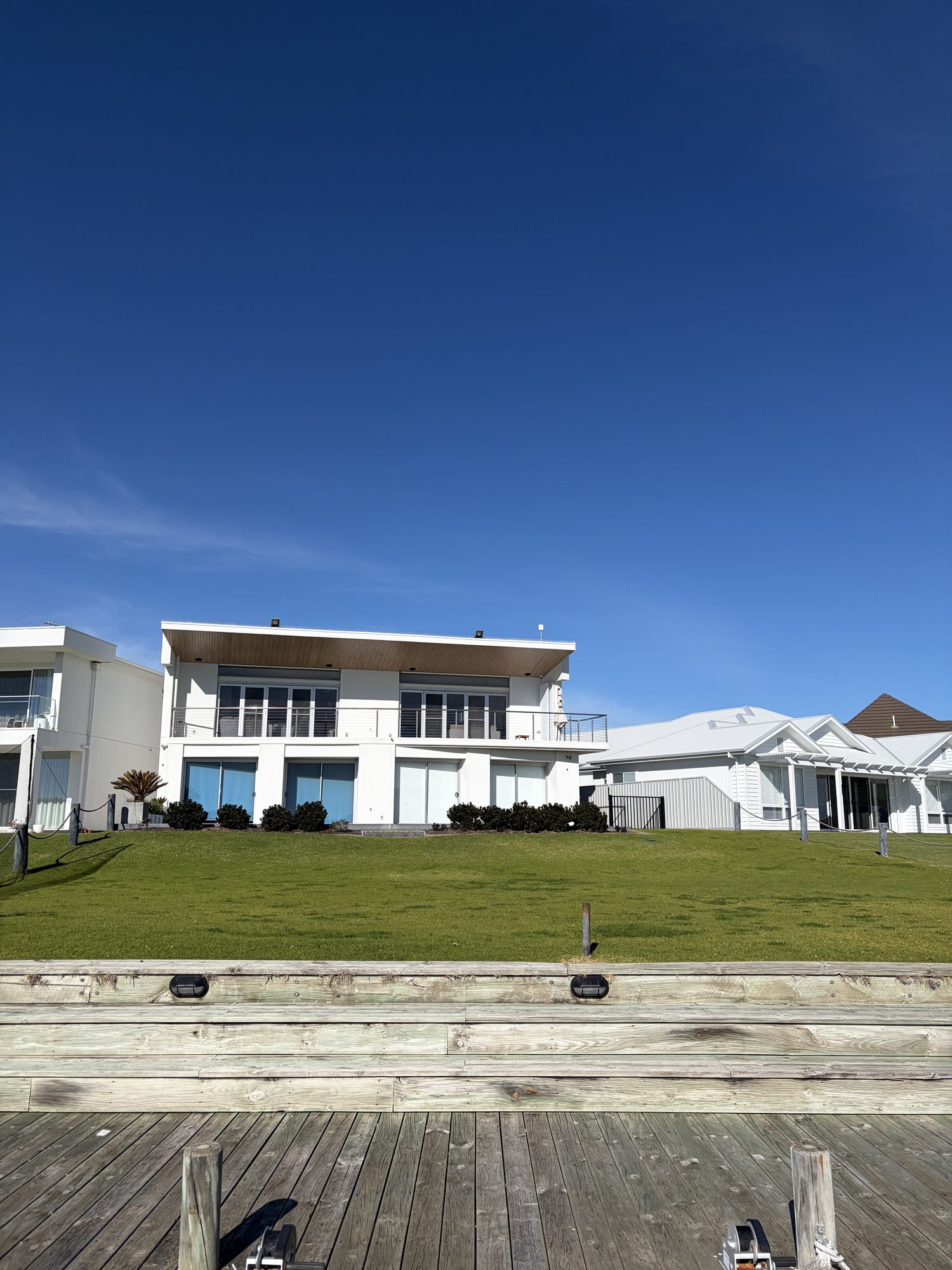 The backyard at the same Hindmarsh Island house looking down the lawn to the water and the private jetty, the far end of the property the wireless design had to reach
