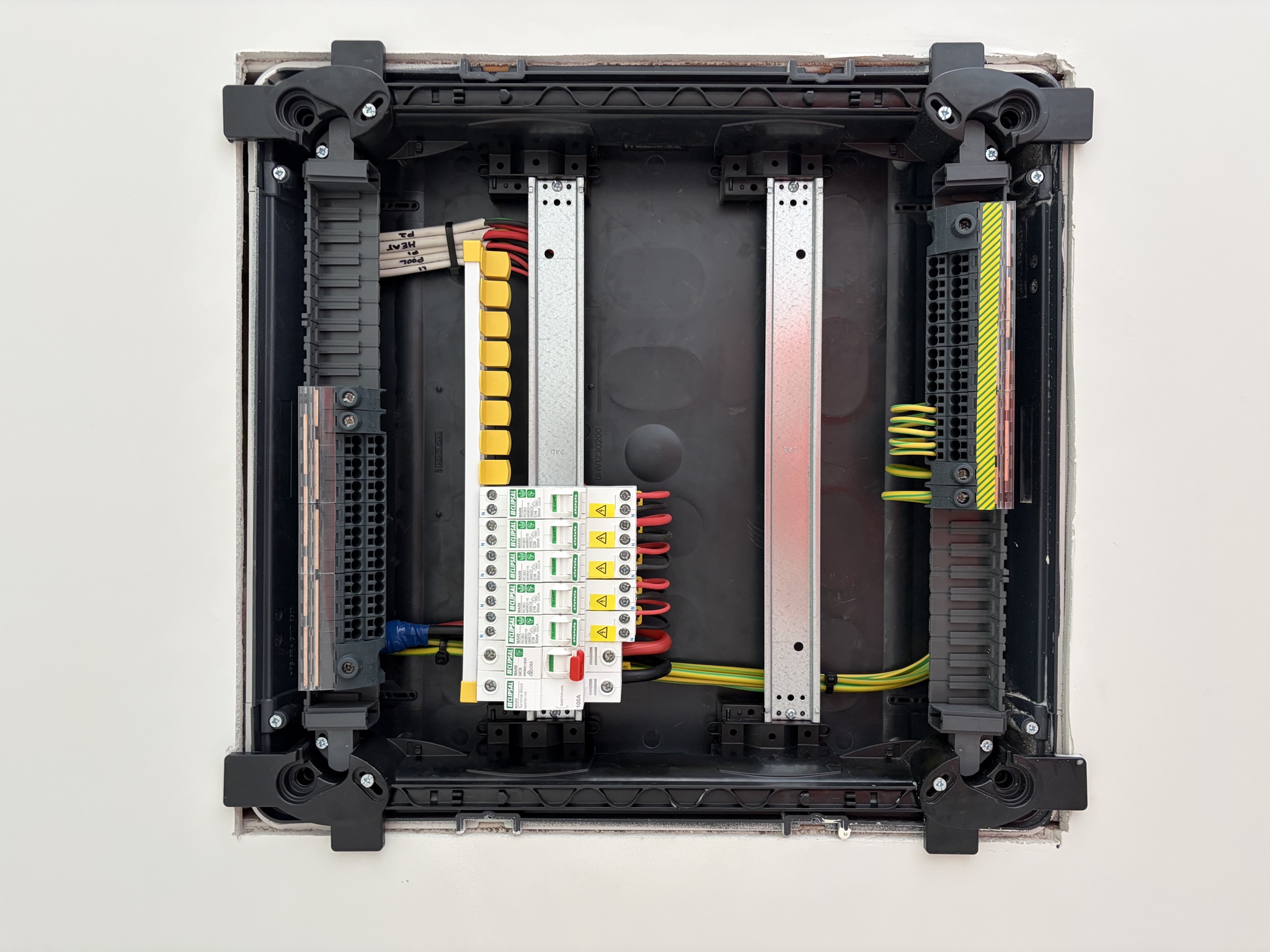Neatly dressed, colour-coded switchboard wiring, an example of East Arc Group's finished electrical work
