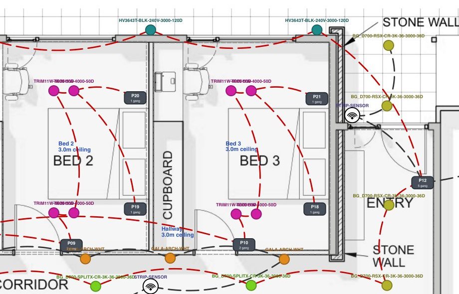 A detail from an East Arc Group lighting and electrical plan for the Norton Summit Residence, showing two bedrooms and a corridor with each fitting called up by manufacturer model number, switch plates numbered and marked with their gang count, ceiling heights noted room by room, and switching runs drawn from every plate to the fittings it controls